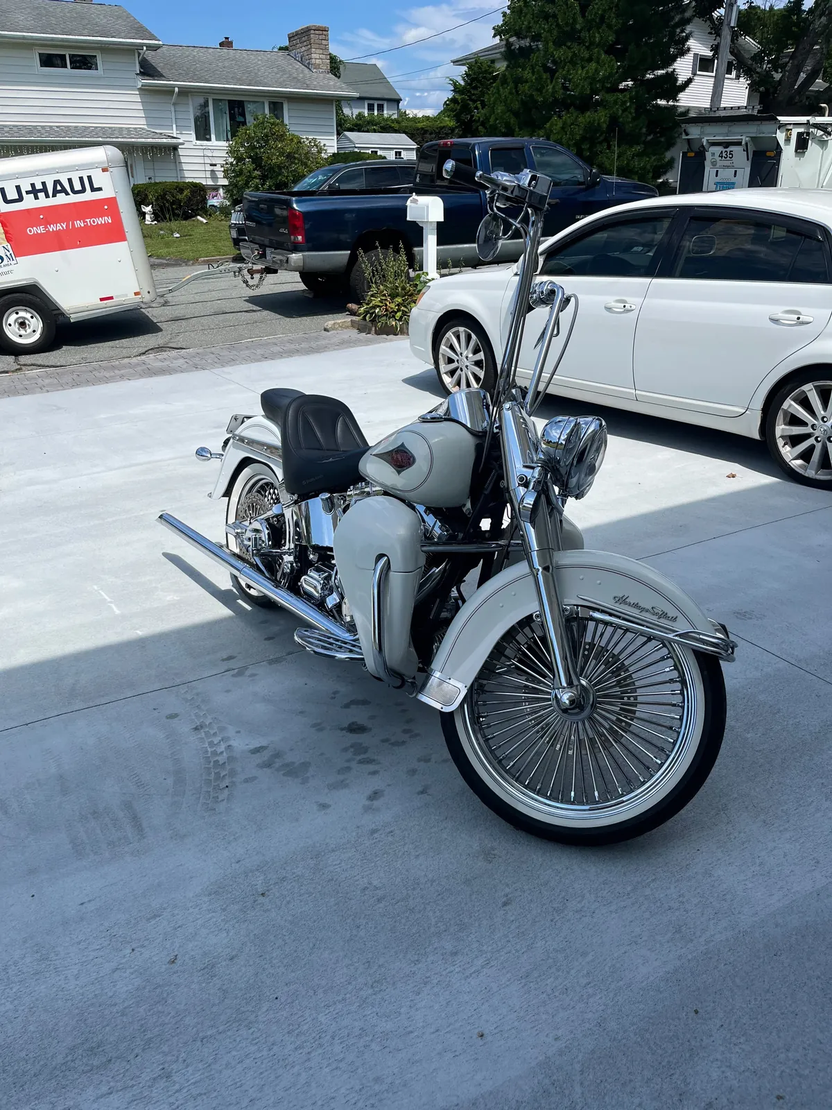 2001 Harley-Davidson Heritage Softail, white Cholo-style build, parked in a driveway